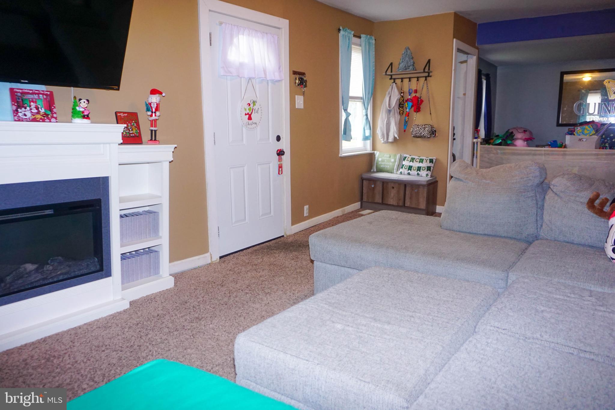 91 Mt Clement Avenue Pine Hill, NJ 08021 - Photo 4 of 27 a living room with furniture and a fireplace