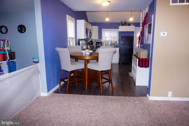 a view of a dining room with furniture