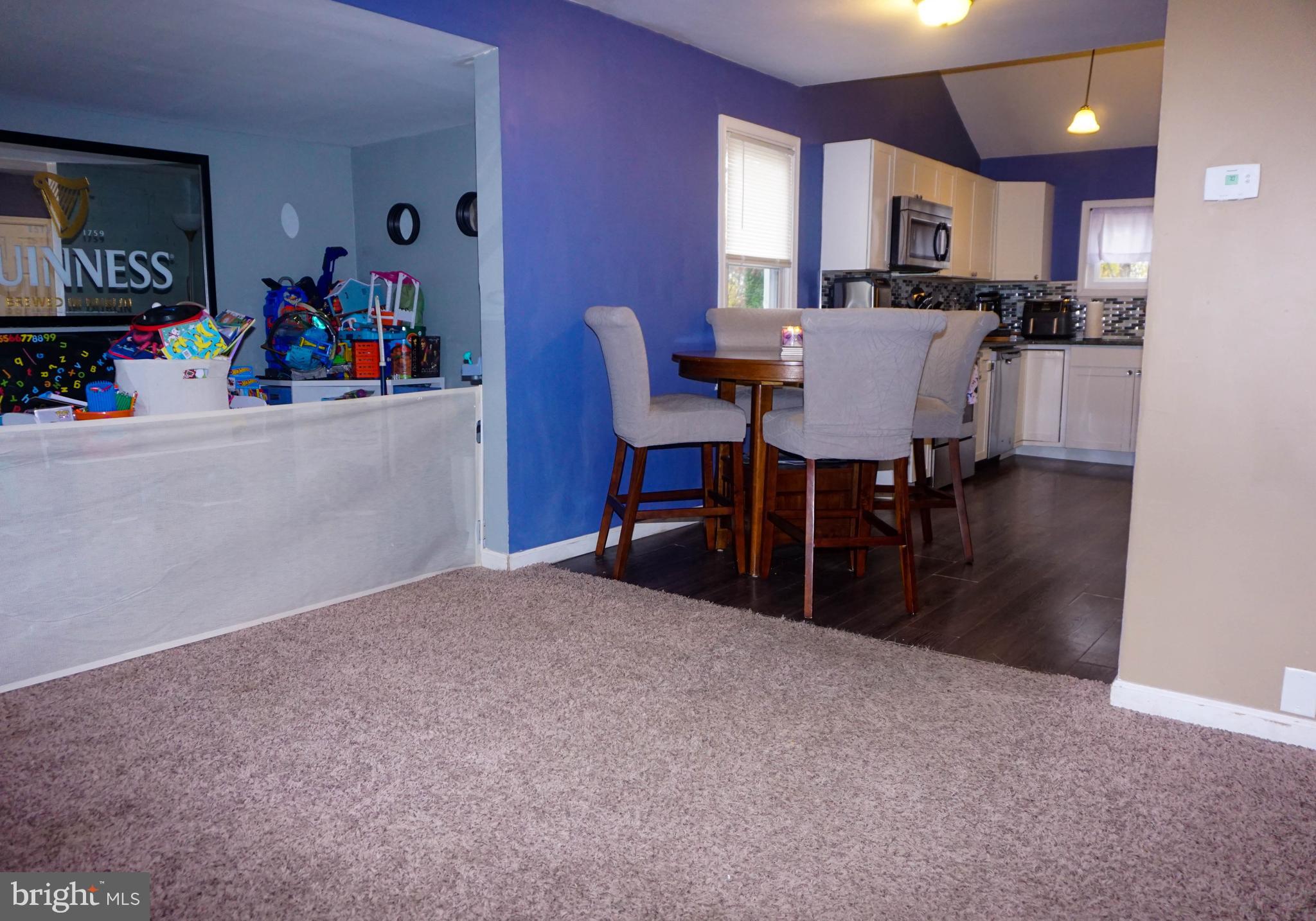 91 Mt Clement Avenue Pine Hill, NJ 08021 - Photo 7 of 27 a view of a dining room with furniture and a chandelier