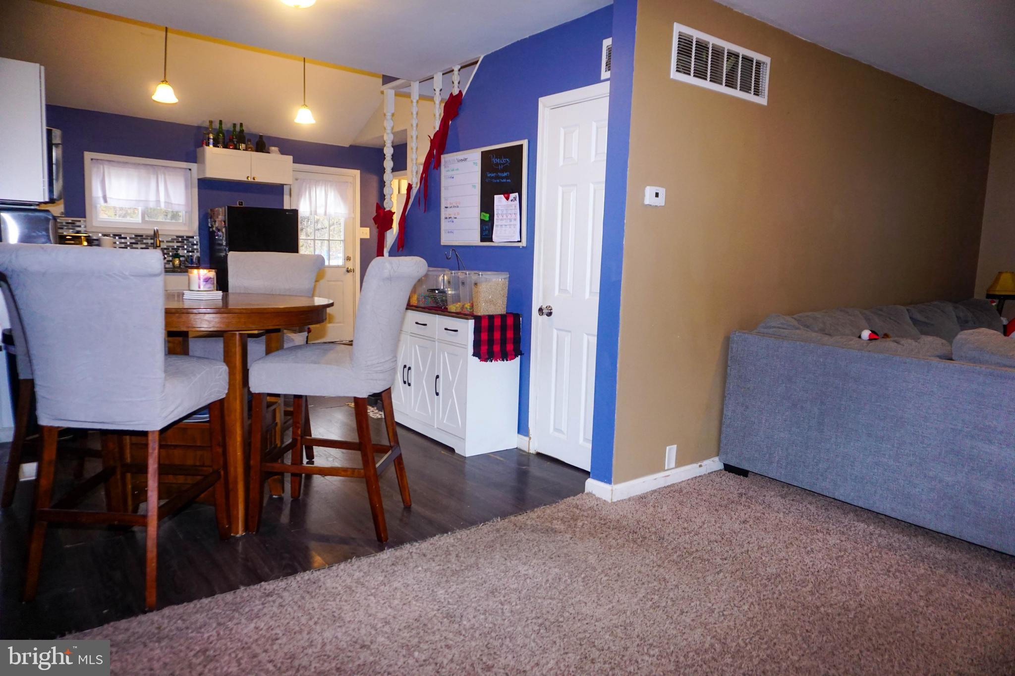91 Mt Clement Avenue Pine Hill, NJ 08021 - Photo 8 of 27 a view of a dining room with furniture and wooden floor