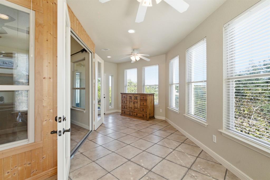 6525 Compass Way Bluff Dale, TX 76433 - Photo 15 of 40 a view of a hallway with wooden floor and windows