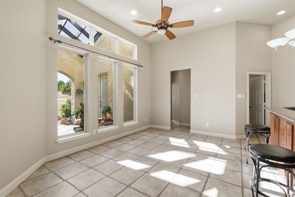 6525 Compass Way Bluff Dale, TX 76433 - Photo 16 of 40 a view of an entryway with a chandelier