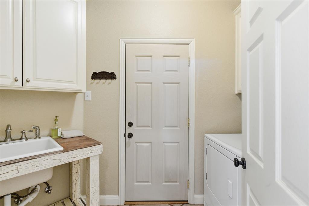 6525 Compass Way Bluff Dale, TX 76433 - Photo 20 of 40 a bathroom with a sink and mirror