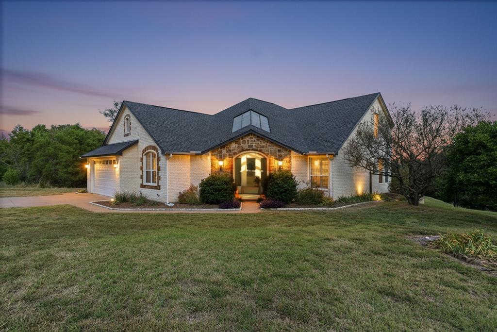 6525 Compass Way Bluff Dale, TX 76433 - Photo 2 of 40 a house that has a big yard