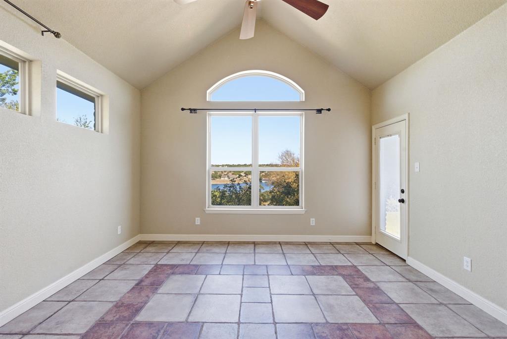 6525 Compass Way Bluff Dale, TX 76433 - Photo 24 of 40 an empty room with a window and a shower