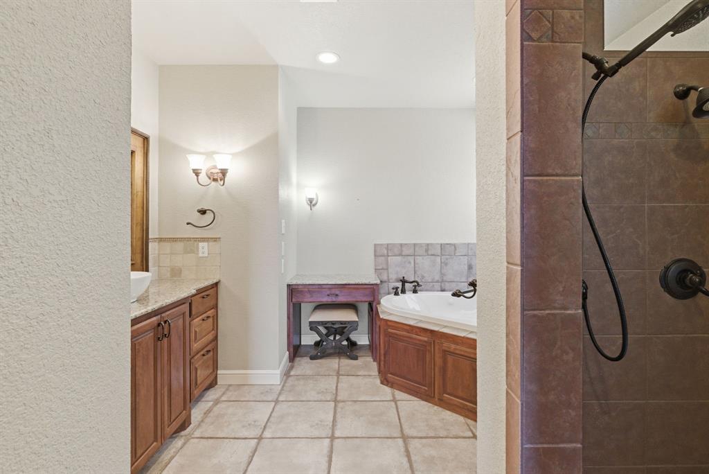 6525 Compass Way Bluff Dale, TX 76433 - Photo 27 of 40 a bathroom with a sink a toilet and shower