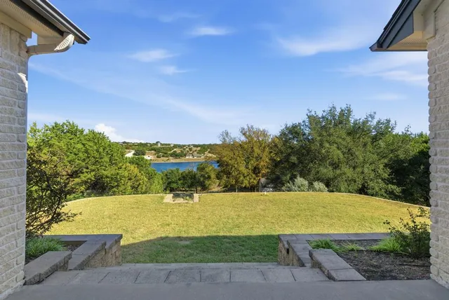 a view of a swimming pool with an outdoor space and seating area
