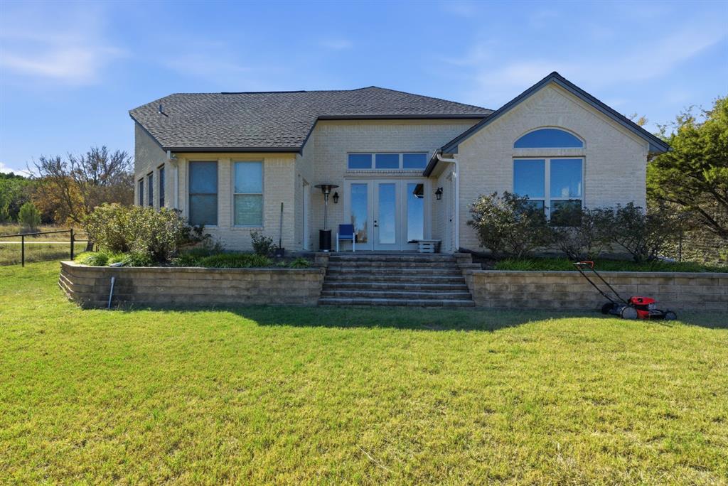 6525 Compass Way Bluff Dale, TX 76433 - Photo 35 of 40 a front view of a house with a yard