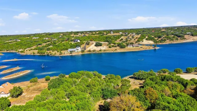 an aerial view of a houses with yard