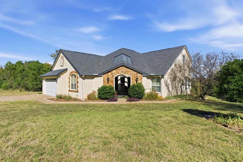 6525 Compass Way Bluff Dale, TX 76433 - Photo 7 of 40 a view of a house with a yard