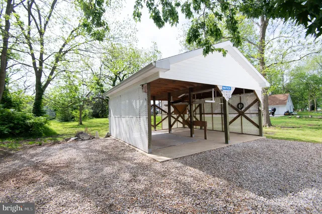 a room with furniture a flat screen tv and a window