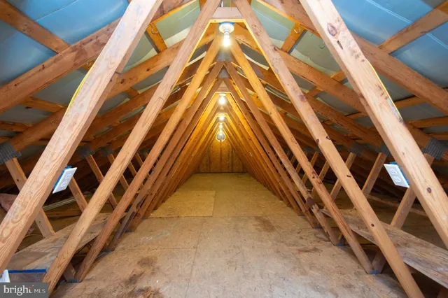 a bedroom with a bed and a ceiling fan