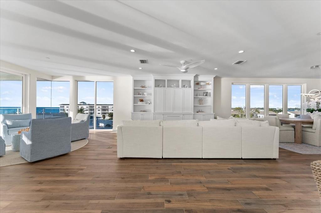 2708 North Beach Road, Unit 5 Englewood, FL 34223 - Photo 15 of 82 a living room with furniture and a wooden floor