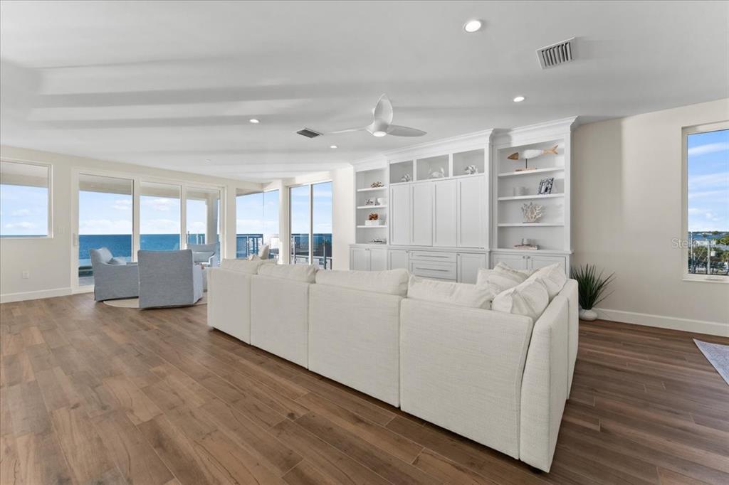 2708 North Beach Road, Unit 5 Englewood, FL 34223 - Photo 17 of 82 a living room with furniture and a wooden floor