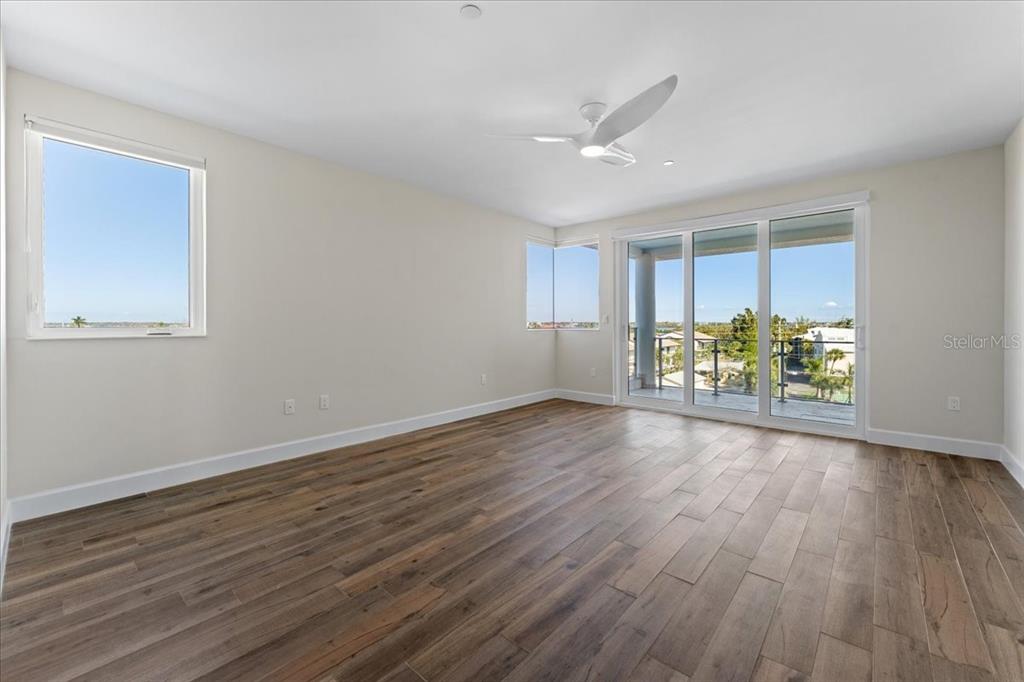 2708 North Beach Road, Unit 5 Englewood, FL 34223 - Photo 43 of 82 a view of room with wooden floor and window