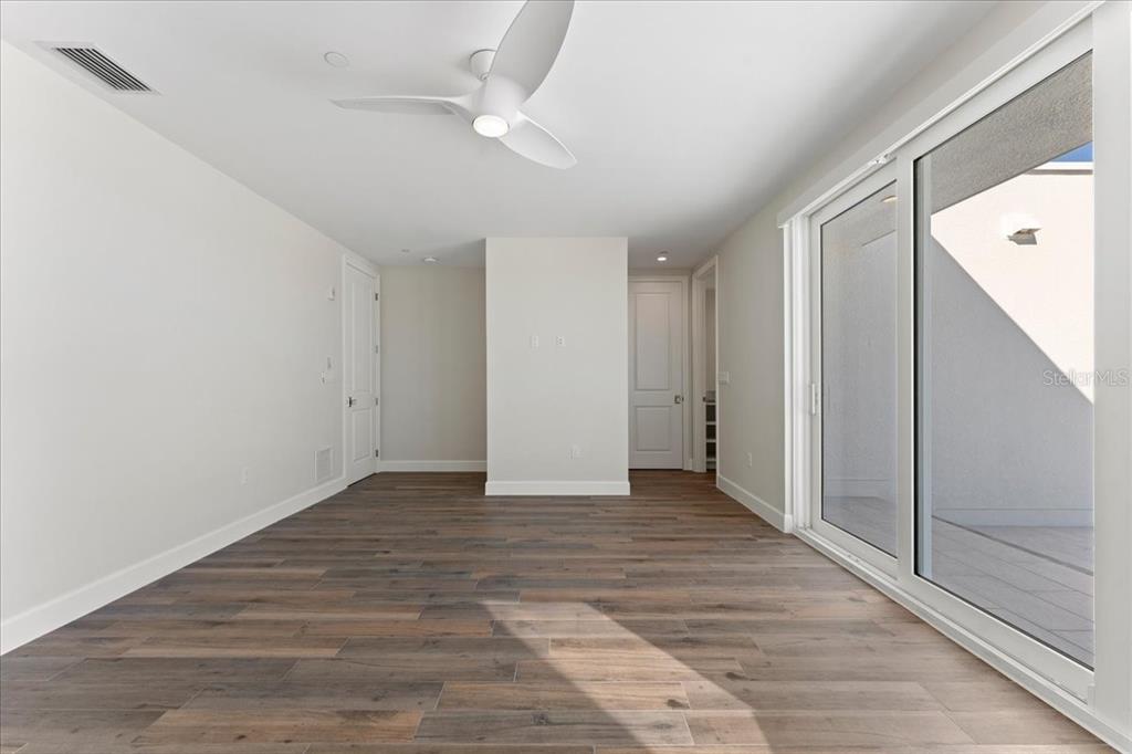 2708 North Beach Road, Unit 5 Englewood, FL 34223 - Photo 54 of 82 a view of an empty room with a window