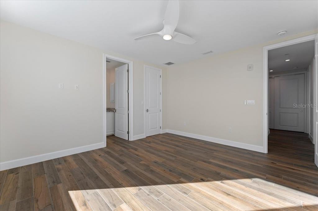 2708 North Beach Road, Unit 5 Englewood, FL 34223 - Photo 64 of 82 wooden floor in an empty room