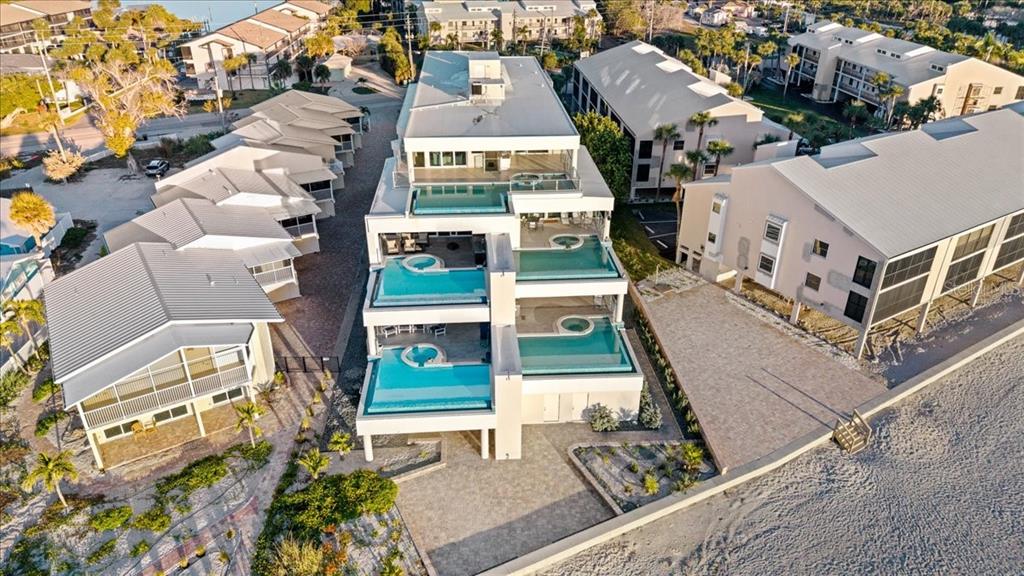 2708 North Beach Road, Unit 5 Englewood, FL 34223 - Photo 78 of 82 an aerial view of residential houses with outdoor space