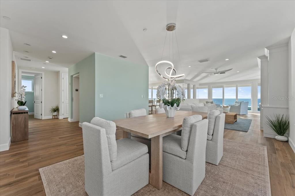 2708 North Beach Road, Unit 5 Englewood, FL 34223 - Photo 10 of 82 a dining hall with stainless steel appliances kitchen island a table and chairs