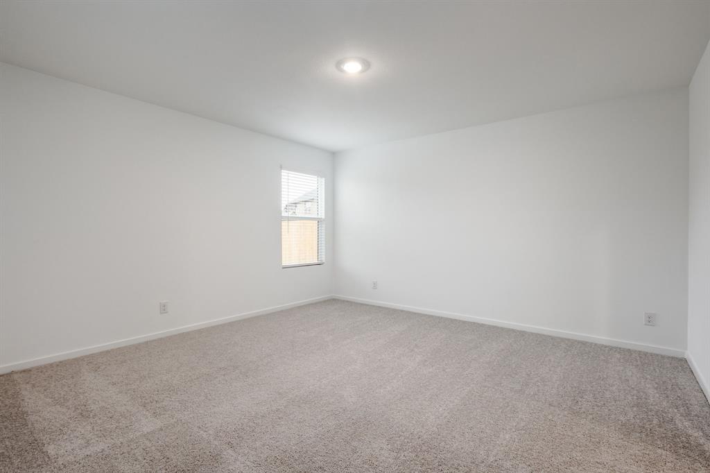 1119 Barbary Flds Street Forney, TX 75126 - Photo 8 of 14 an empty room with windows