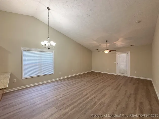 a kitchen with stainless steel appliances granite countertop a sink a stove a microwave and cabinets