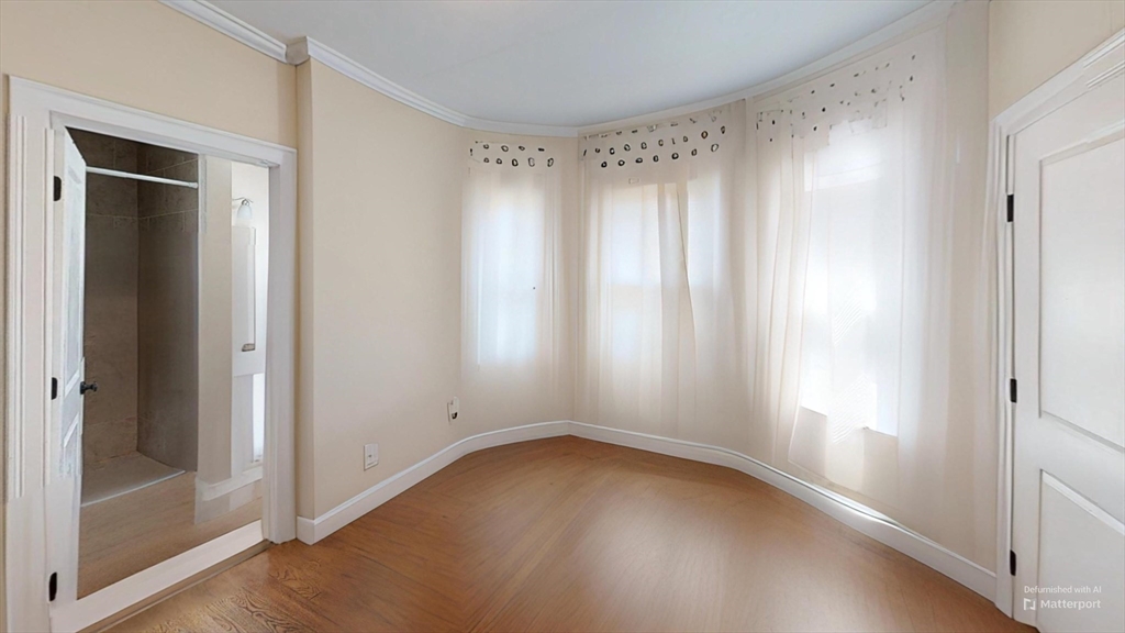 2975 Washington Street, Unit 2 Boston, MA 02119 - Photo 2 of 8 a view of an empty room with a window