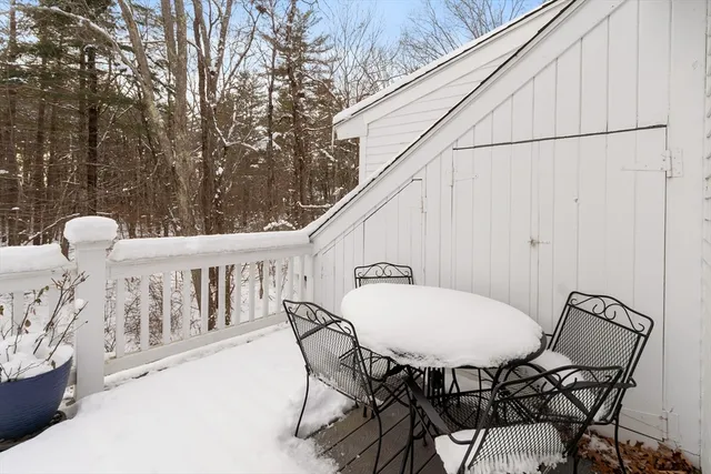 a view of balcony with table and chairs