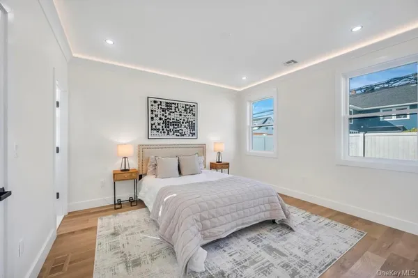 a bedroom with a bed and a lamp