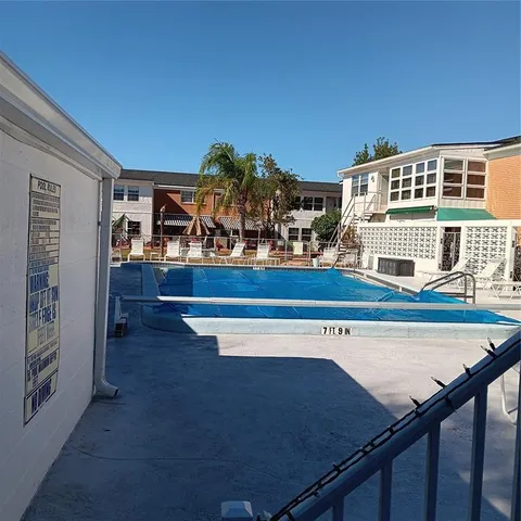 a view of a living room and kitchen
