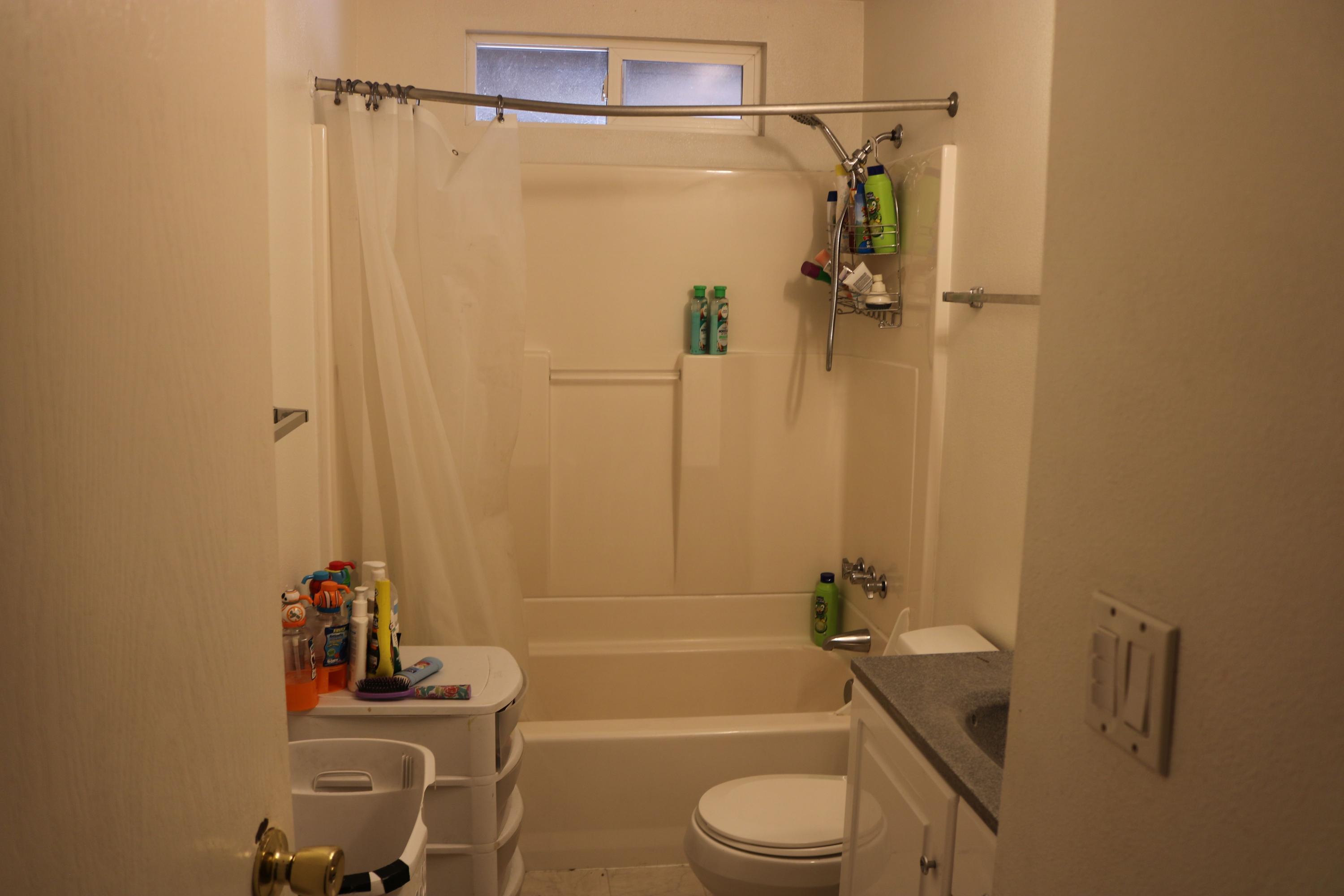 2180 Crestbrook Road Medford, OR 97504 - Photo 8 of 10 a bathroom with a sink a toilet and shower