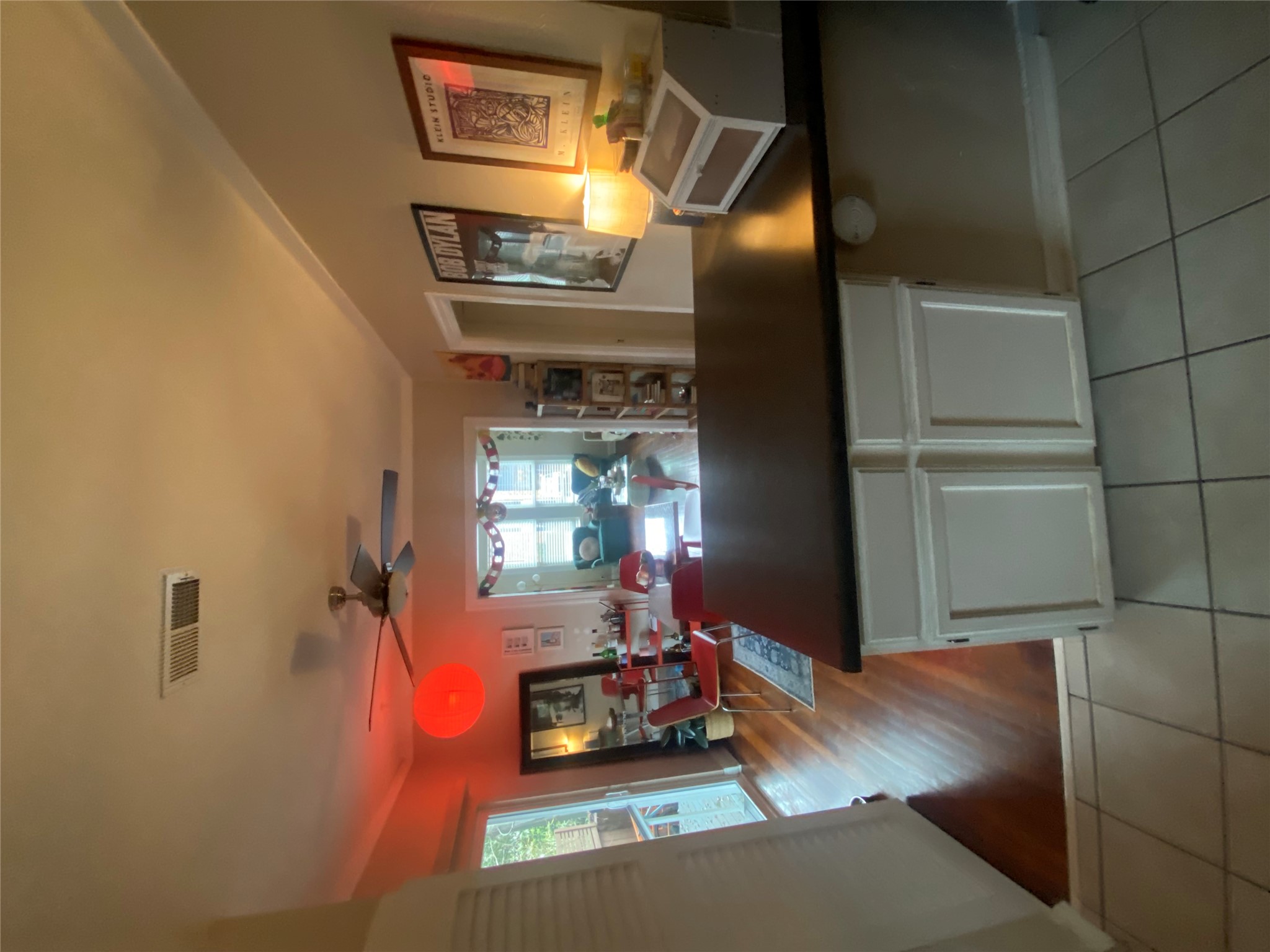 3010 Fruth Street, Unit A Austin, TX 78705 - Photo 9 of 39 Open-concept living space featuring wood-finish flooring, a ceiling fan, and crown molding