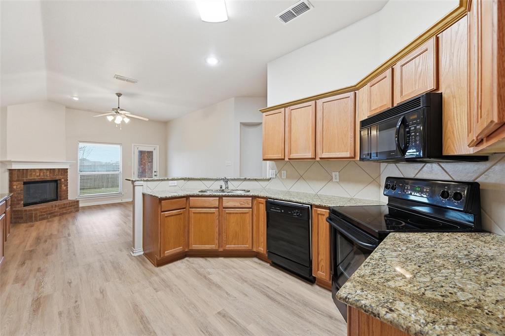 4416 Ridgeway Drive Mansfield, TX 76063 - Photo 11 of 27 Kitchen view into family den area