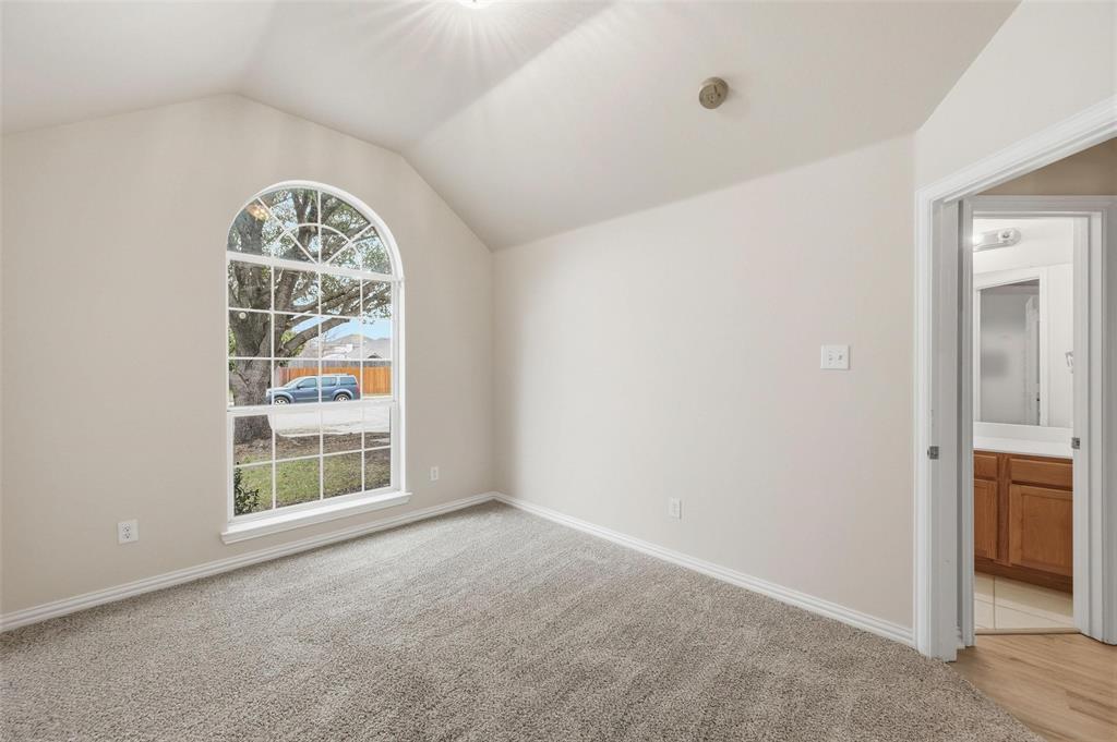 4416 Ridgeway Drive Mansfield, TX 76063 - Photo 19 of 27 Front bedroom with arched window and high ceilings