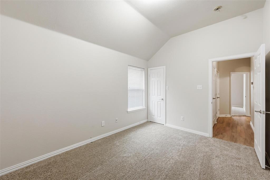 4416 Ridgeway Drive Mansfield, TX 76063 - Photo 23 of 27 Back bedroom view into hall - all bedrooms feature walk in closets!