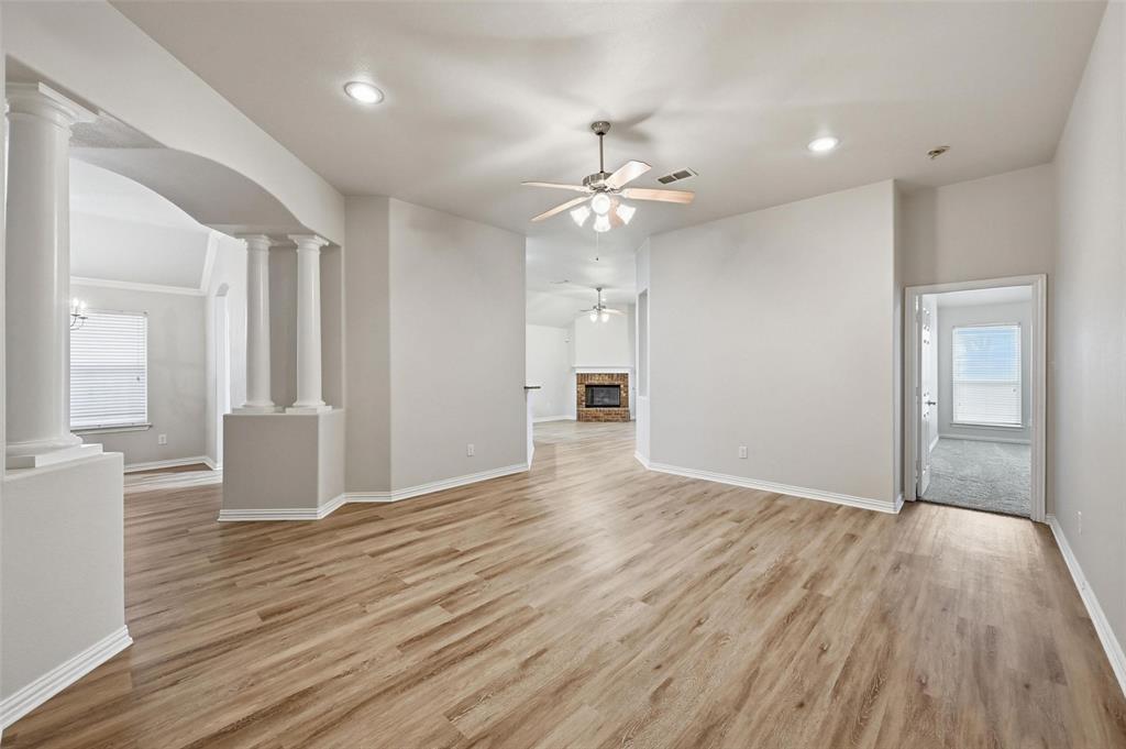 4416 Ridgeway Drive Mansfield, TX 76063 - Photo 4 of 27 Main living room with plenty of natural light and NEW neutral LVP flooring