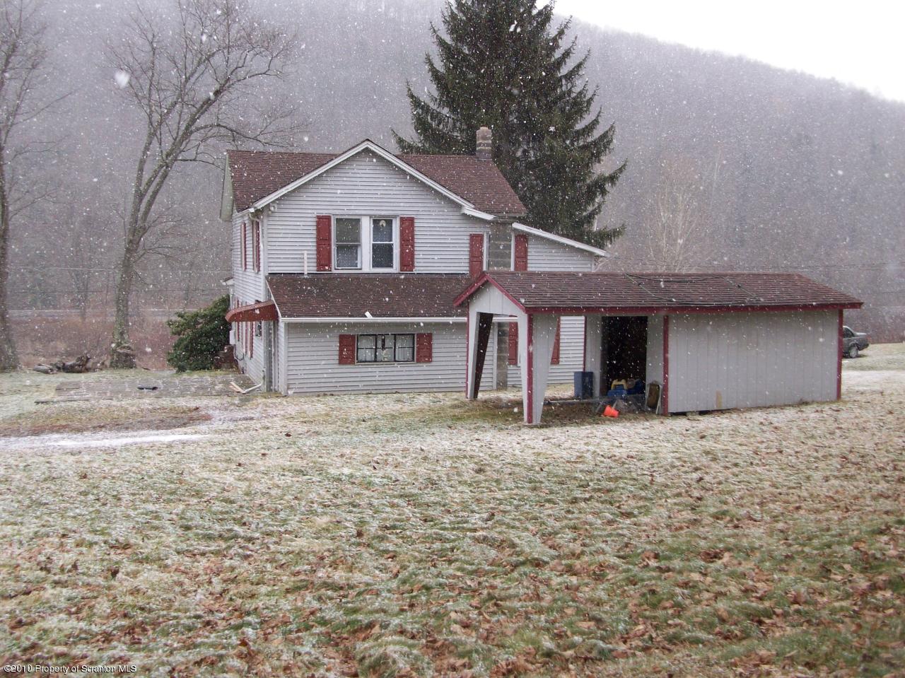 Rr1 Rr1 Hop Bottom, PA 18824 - Photo 3 of 10 a front view of a house with a yard