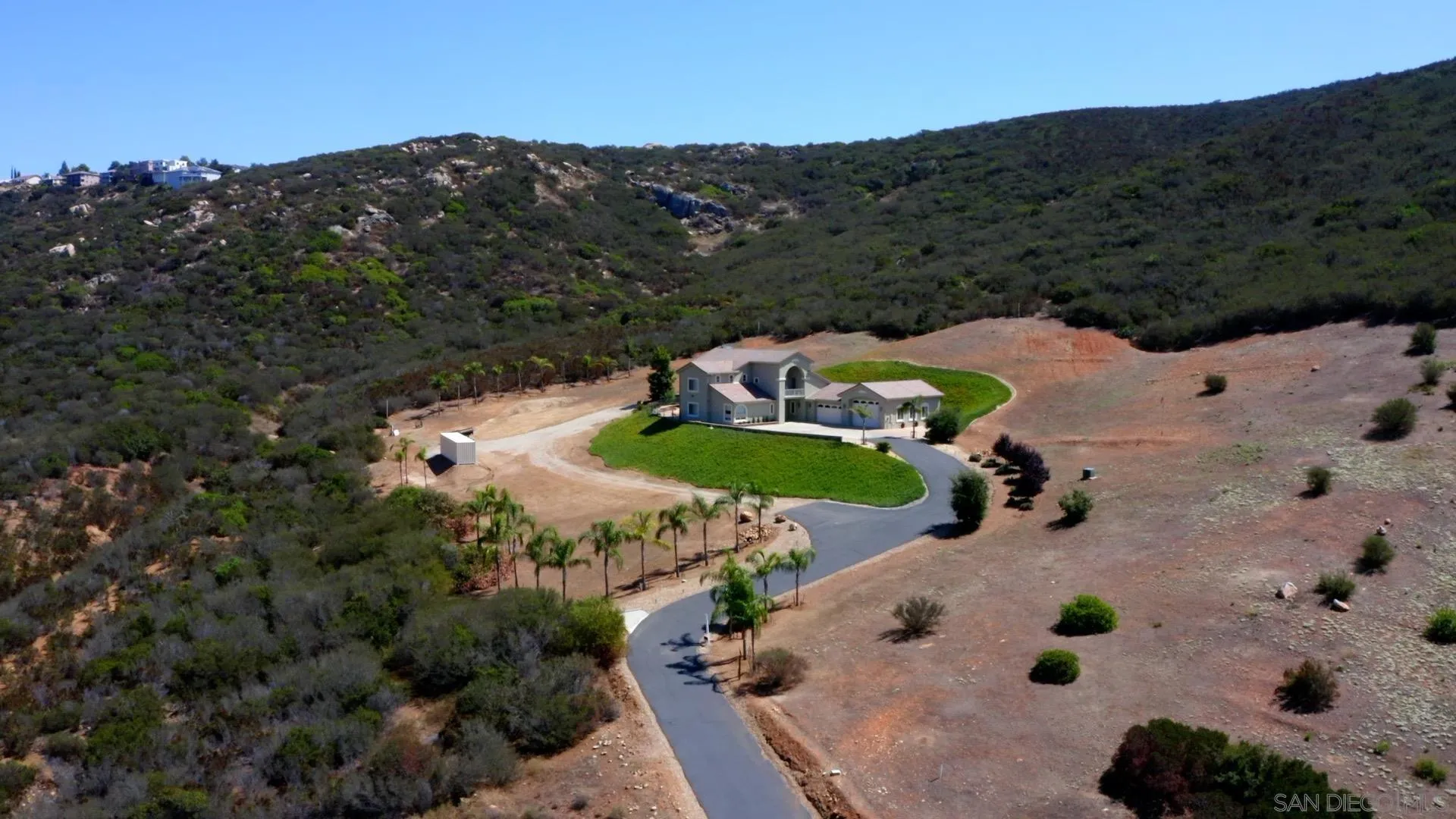 an aerial view of house with a yard