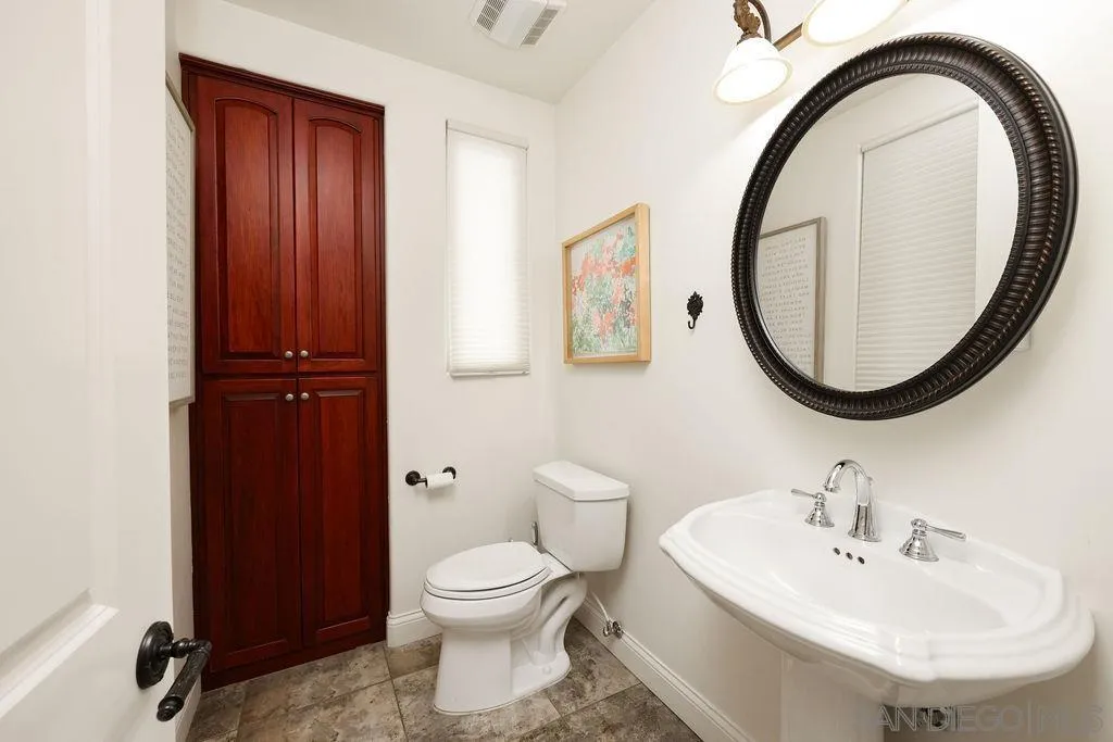 23085 Tombill Road Ramona, CA 92065 - Photo 22 of 43 a bathroom with a sink and a mirror