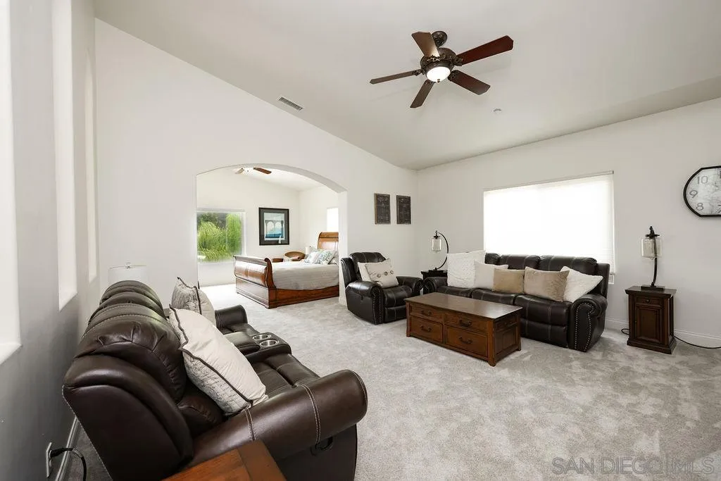23085 Tombill Road Ramona, CA 92065 - Photo 23 of 43 a living room with furniture ceiling fan and a rug