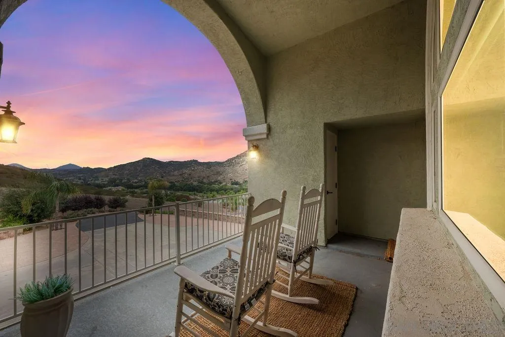 23085 Tombill Road Ramona, CA 92065 - Photo 25 of 43 a view of a balcony with furniture and wooden floor