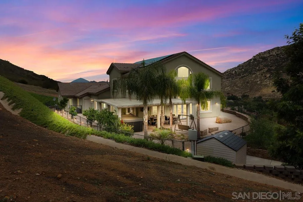 23085 Tombill Road Ramona, CA 92065 - Photo 27 of 43 a view of a house with a yard and potted plants