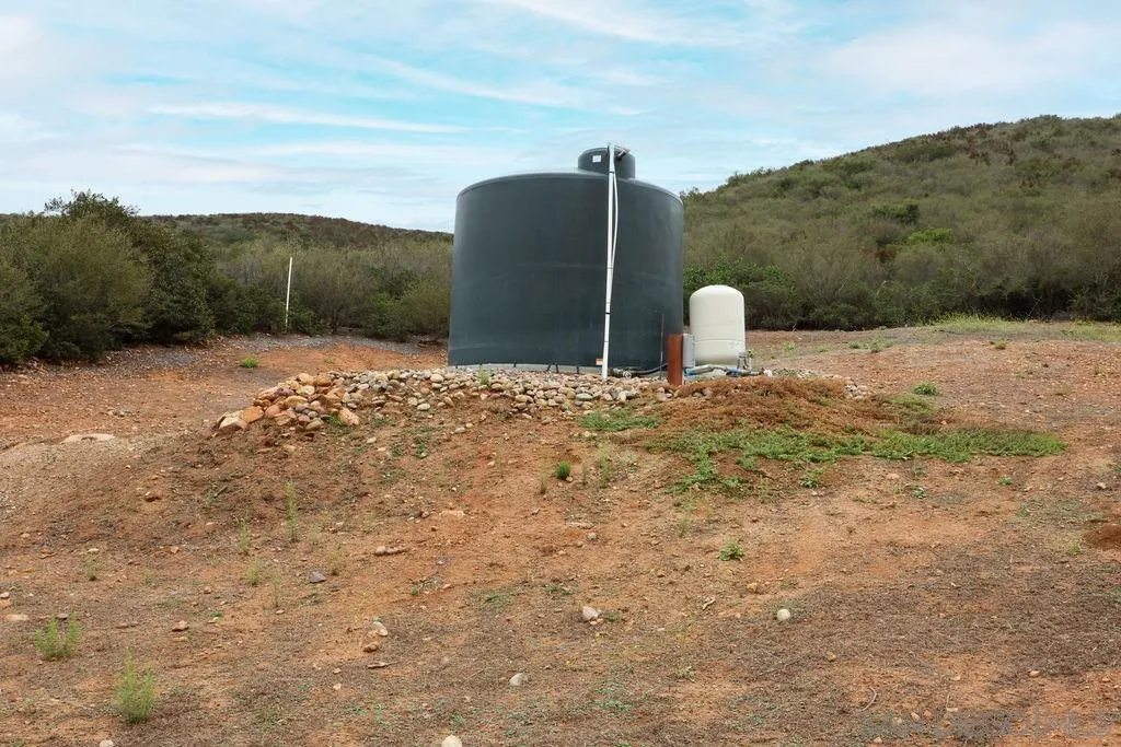 23085 Tombill Road Ramona, CA 92065 - Photo 28 of 43 a view of a tall trees with a view of a yard