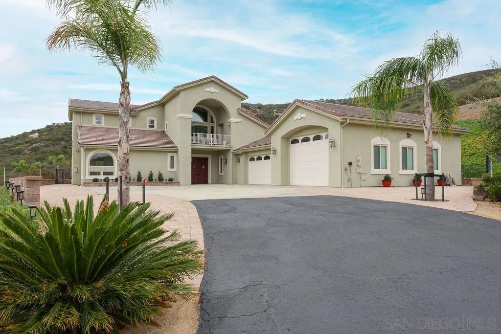 23085 Tombill Road Ramona, CA 92065 - Photo 29 of 43 a front view of a house with a garden