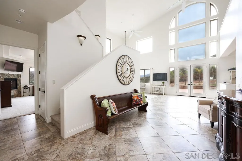 23085 Tombill Road Ramona, CA 92065 - Photo 3 of 43 a living room with furniture a clock and a view of living room
