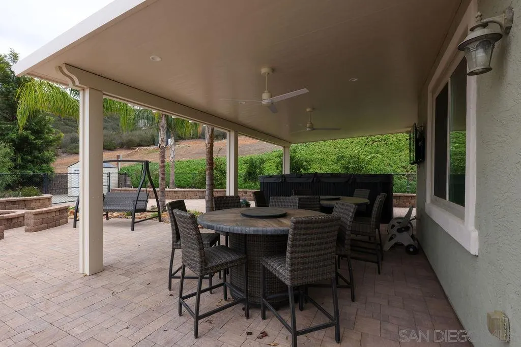 23085 Tombill Road Ramona, CA 92065 - Photo 34 of 43 a view of an outdoor dining space with furniture and garden