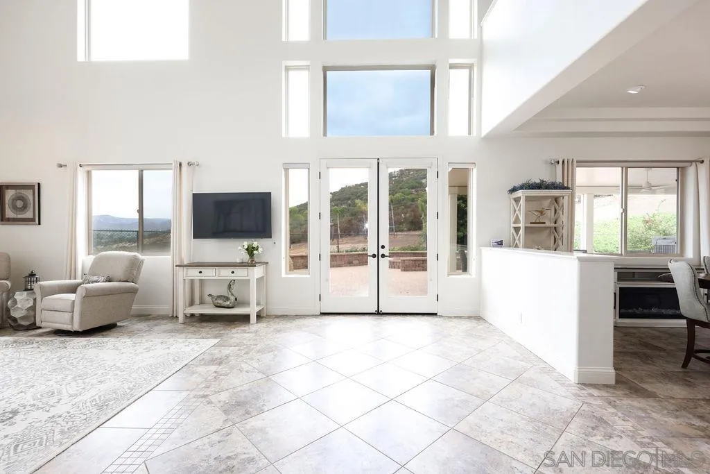 23085 Tombill Road Ramona, CA 92065 - Photo 4 of 43 a living room with furniture and large flat screen tv