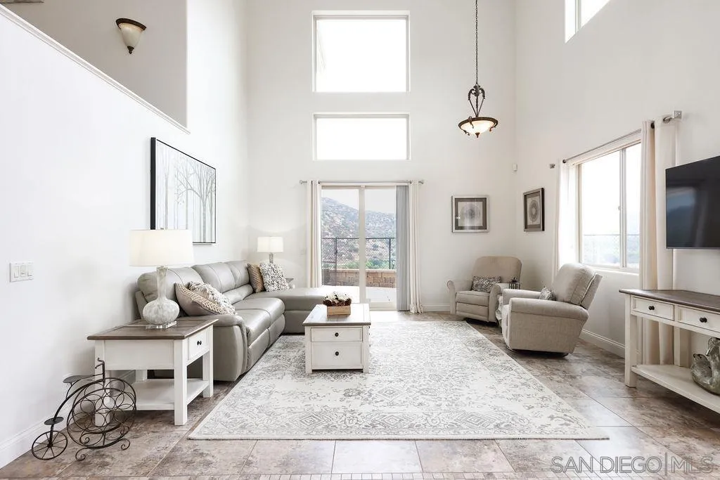 23085 Tombill Road Ramona, CA 92065 - Photo 5 of 43 a living room with furniture and a flat screen tv