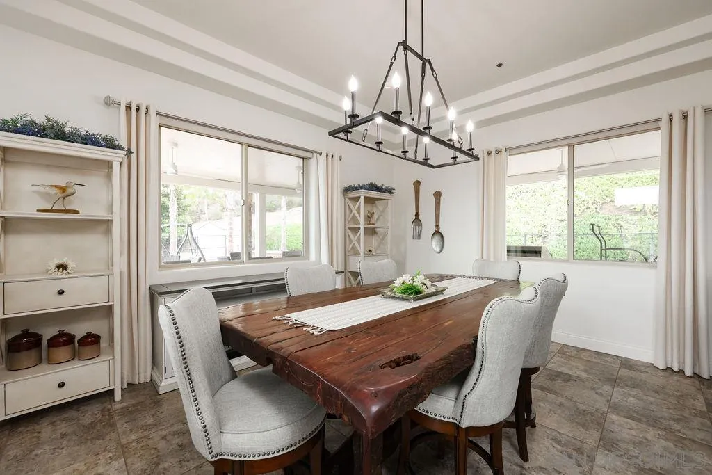 23085 Tombill Road Ramona, CA 92065 - Photo 7 of 43 a view of a dining room with furniture window and outside view