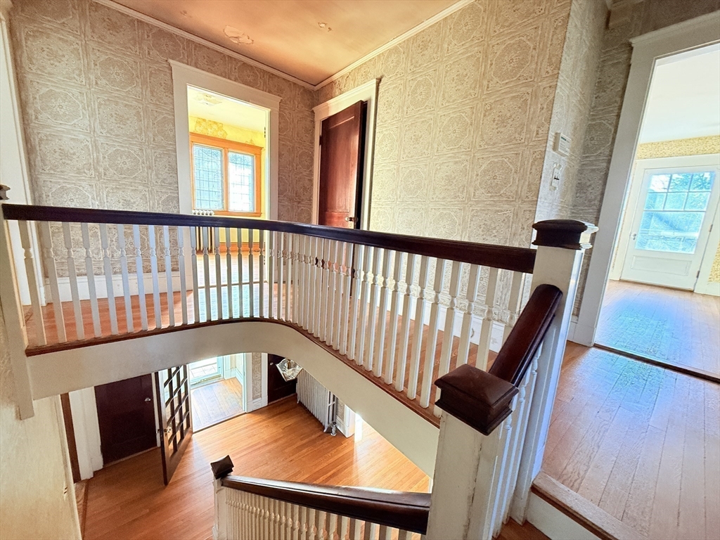 30 Payson Road Belmont, MA 02478 - Photo 13 of 17 a view of a hallway with wooden floor and seating