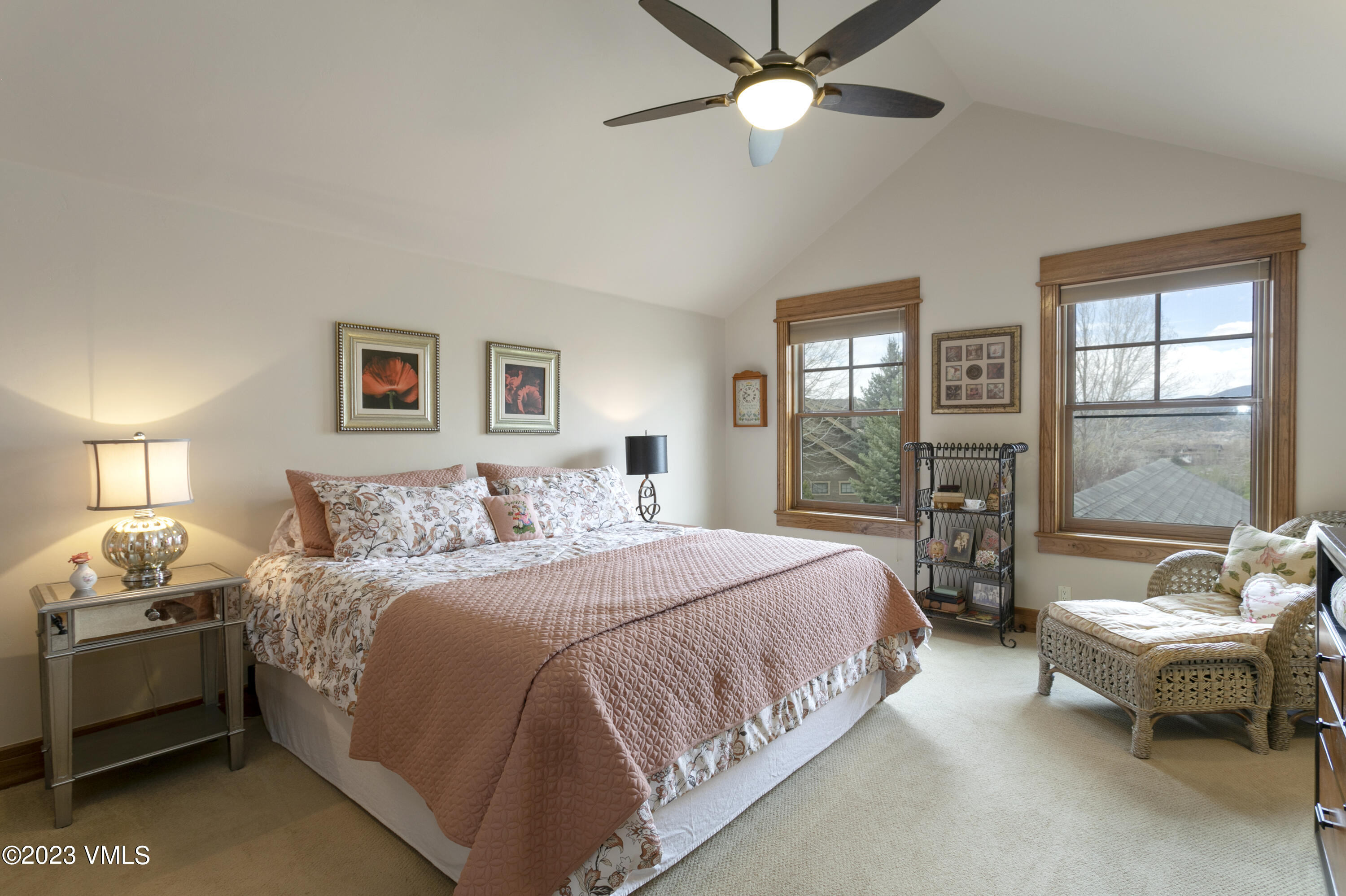 106 East Double Hitch Eagle, CO 81631 - Photo 14 of 28 a bedroom with a bed and a chandelier